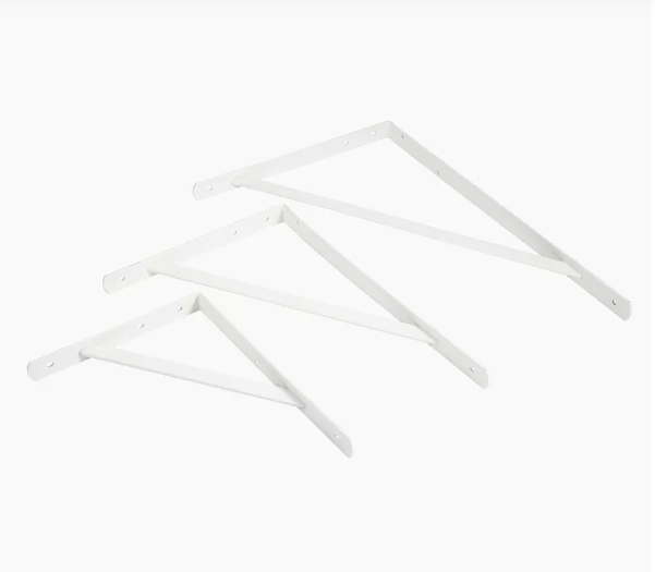 Three white metal brackets. Three white metal brackets.