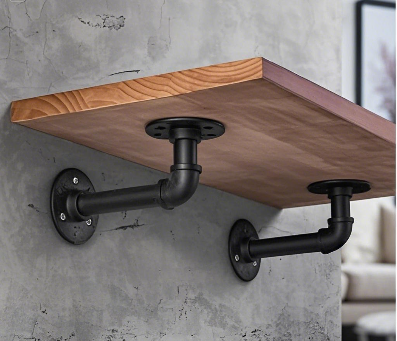 Wooden shelf supported by black metal brackets.