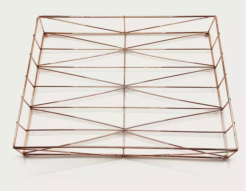 A copper - colored metal wire rack.
